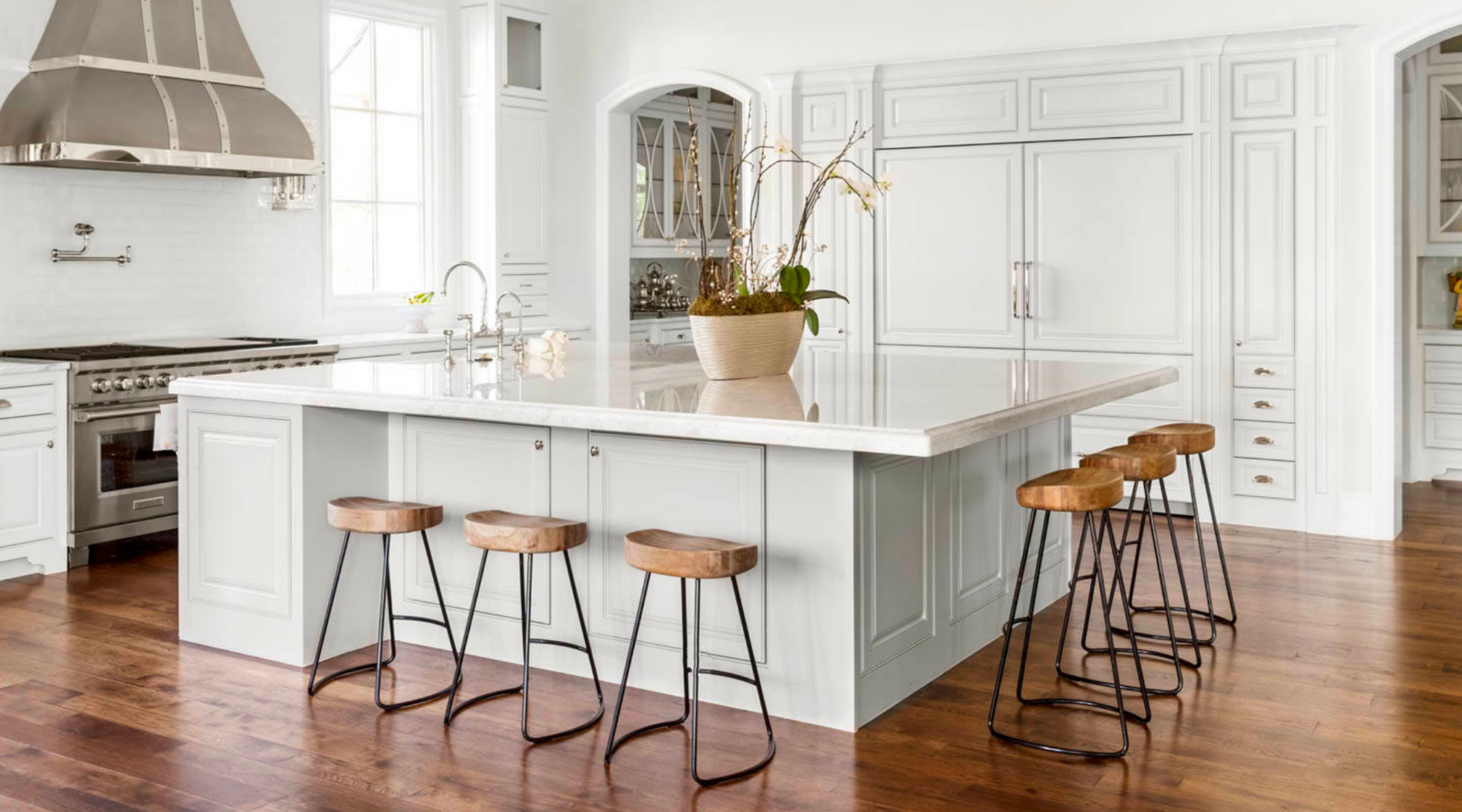 Customers kitchen island with hidden granite counterop brackets on two sides of the island providing support for the overhangs.