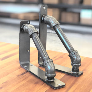 Industrial Pipe Corbels with a clear powder coat finish over raw metal. 