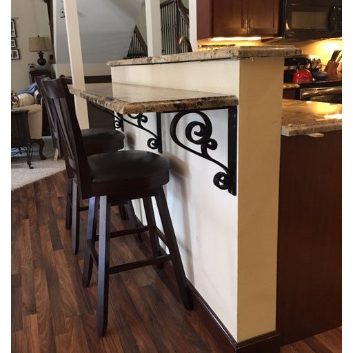 This is a picture of our 2-inch wide scroll corbel supporting a customers stone bar.